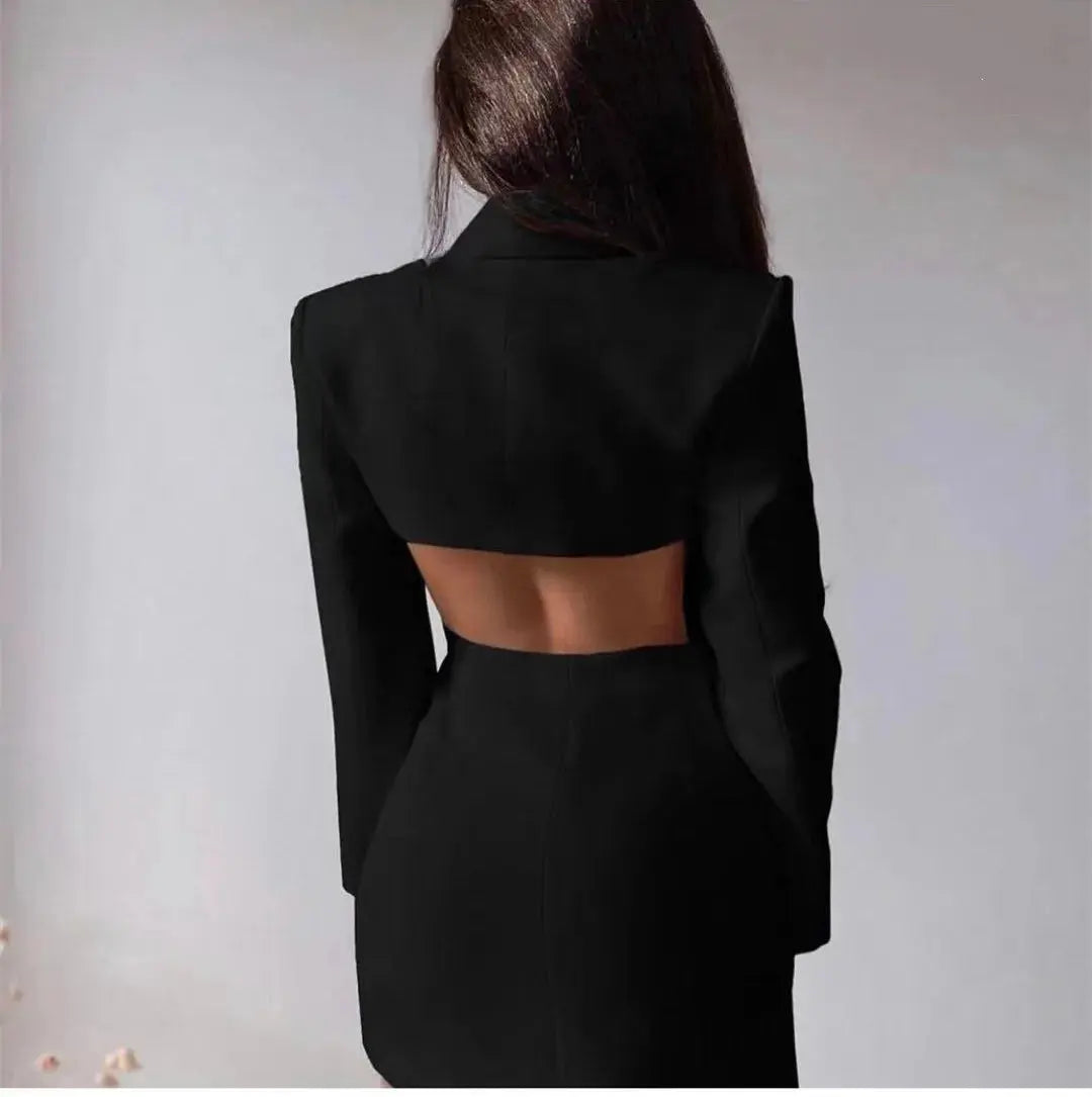 Model wearing a black backless blazer dress, perfect for business meetings and evening events.