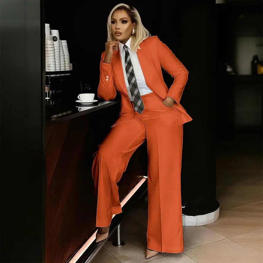 Chic white suit set worn by a woman in a modern office environment.
