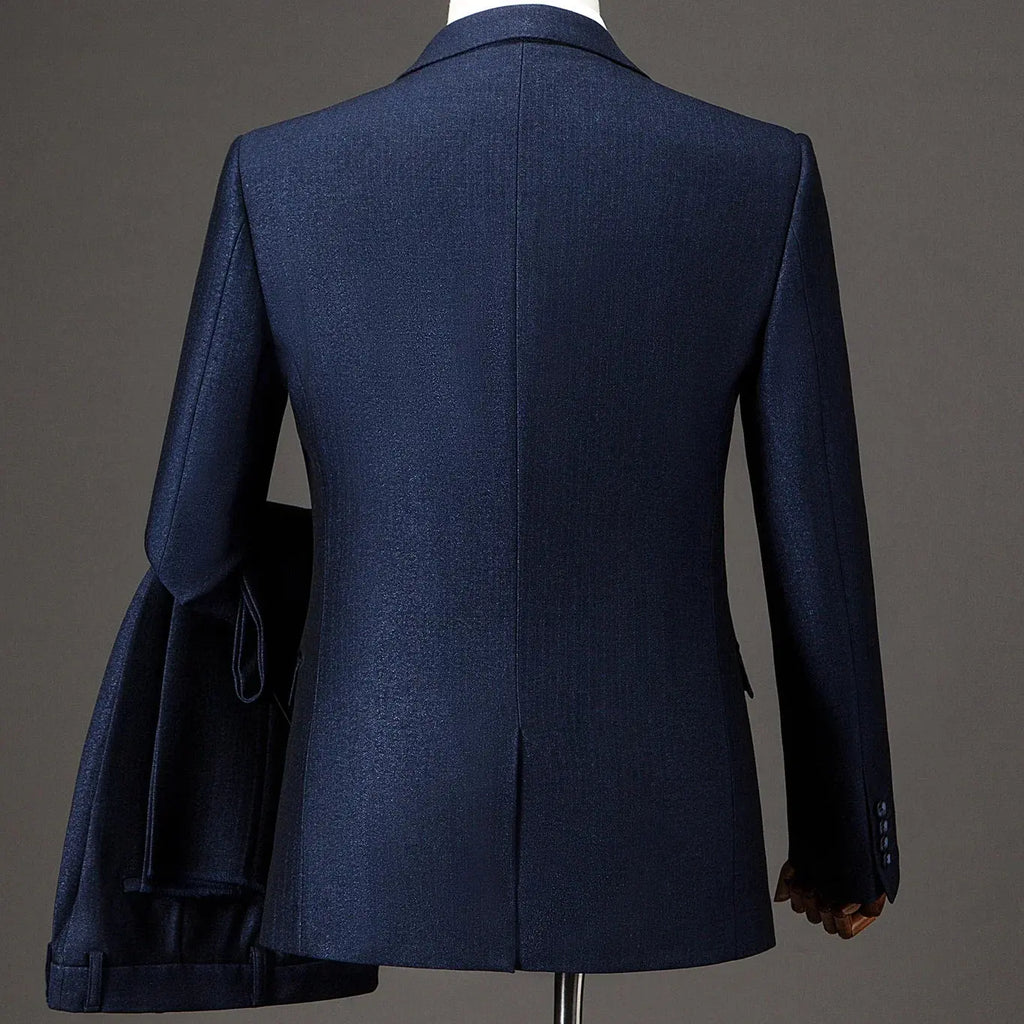 Close-up of the breathable, wrinkle-resistant fabric of the navy suit.