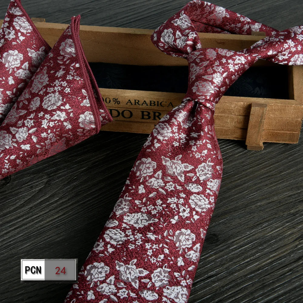 Sophisticated wine-red scarf complements the tie perfectly.