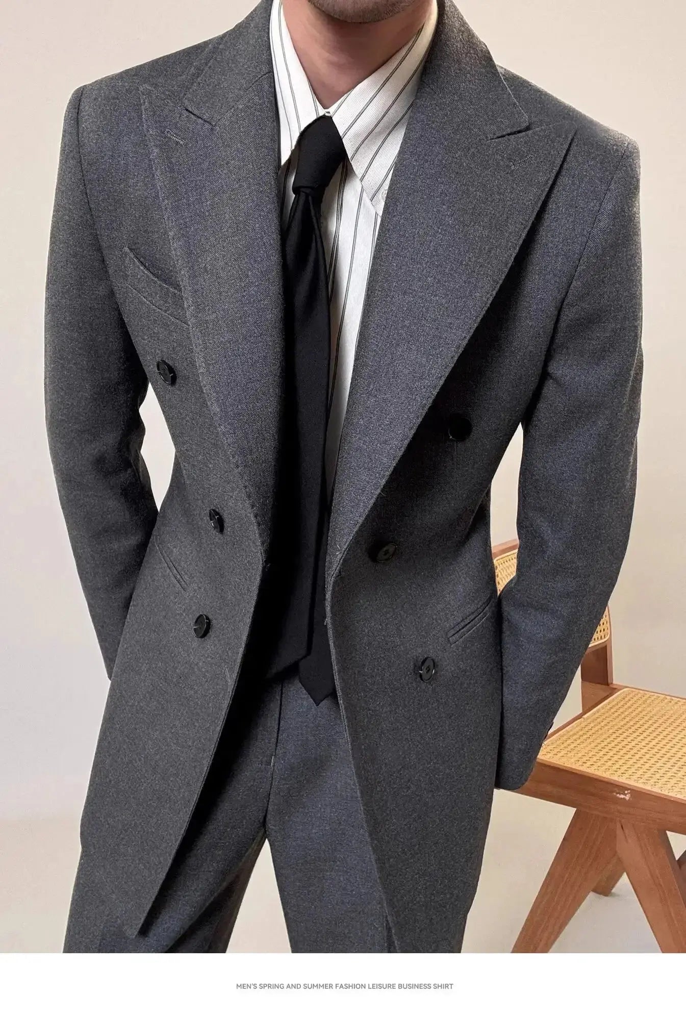 Detail shot of the fabric texture of the men's power suit, illustrating quality and elegance.