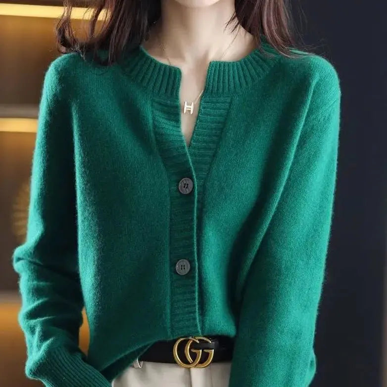 Cozy knitwear displayed on a mannequin in a winter setting.