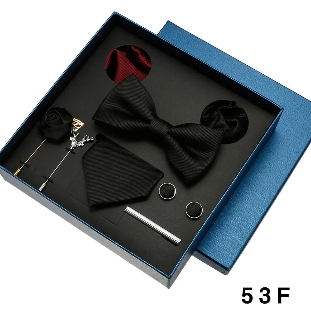 Navy blue wedding tie collection with bowtie, pocket square and silver cufflinks