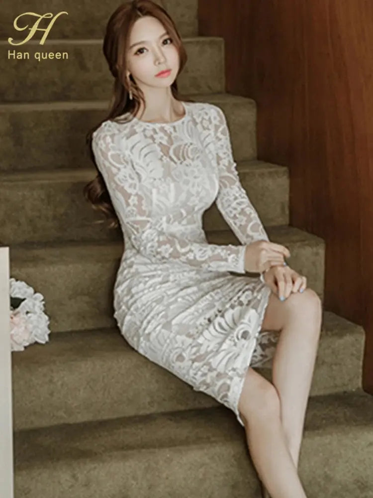 Back view of zip-up lace dress, emphasizing its structured design and elegant lines.