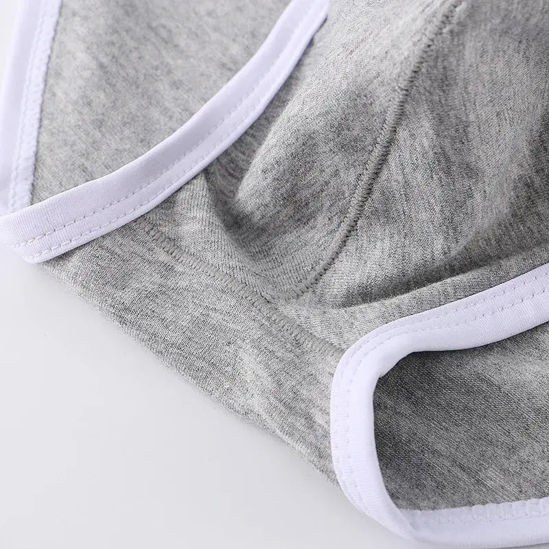 Low-rise Sculpted Comfort Briefs in navy, enhancing natural shape and silhouette.