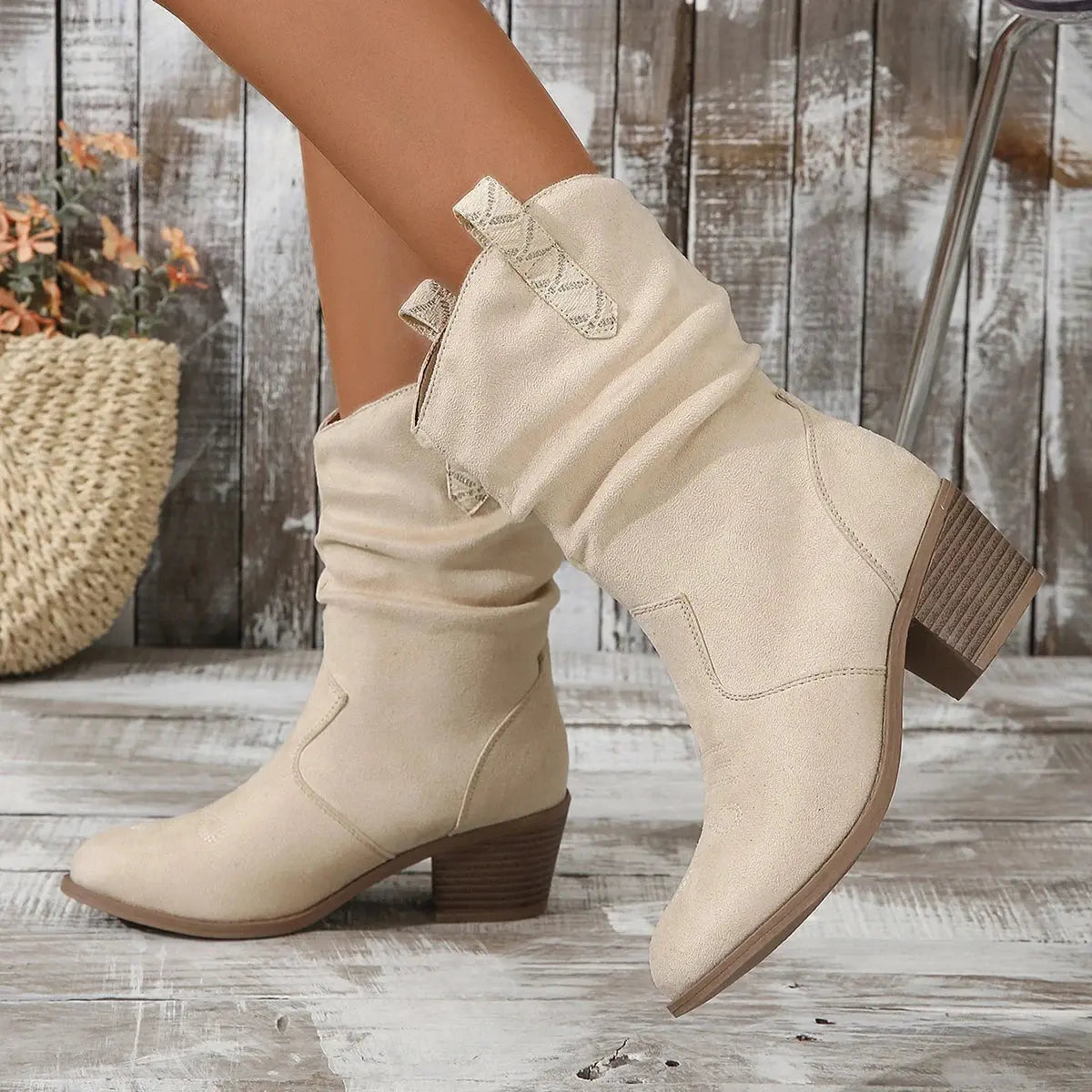 Chunky heel cowgirl boots in neutral tone with authentic frontier-inspired embroidery