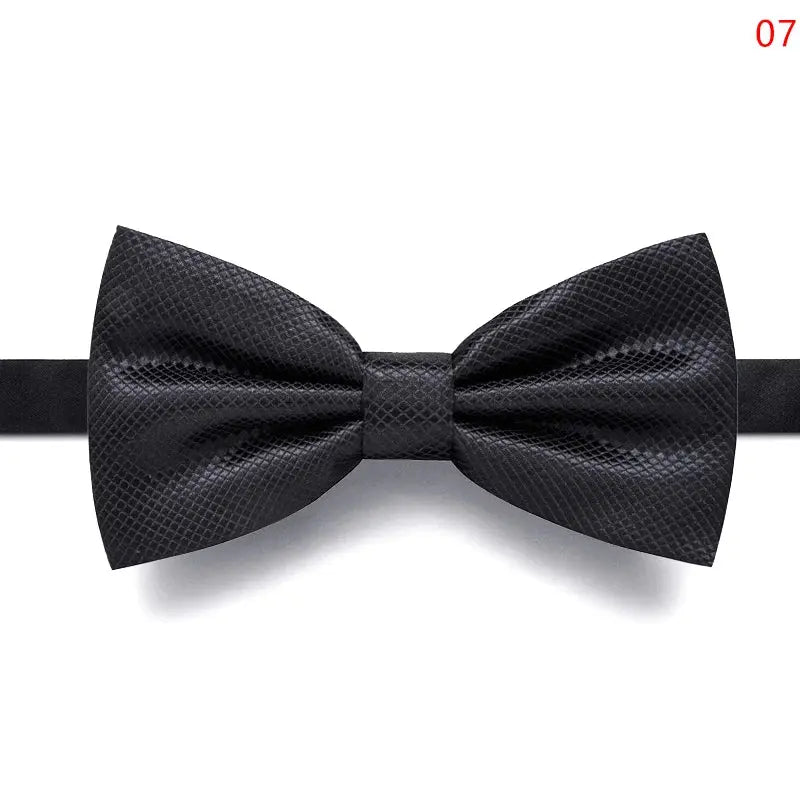 Black bow tie worn at a gala dinner, enhancing the formal attire.