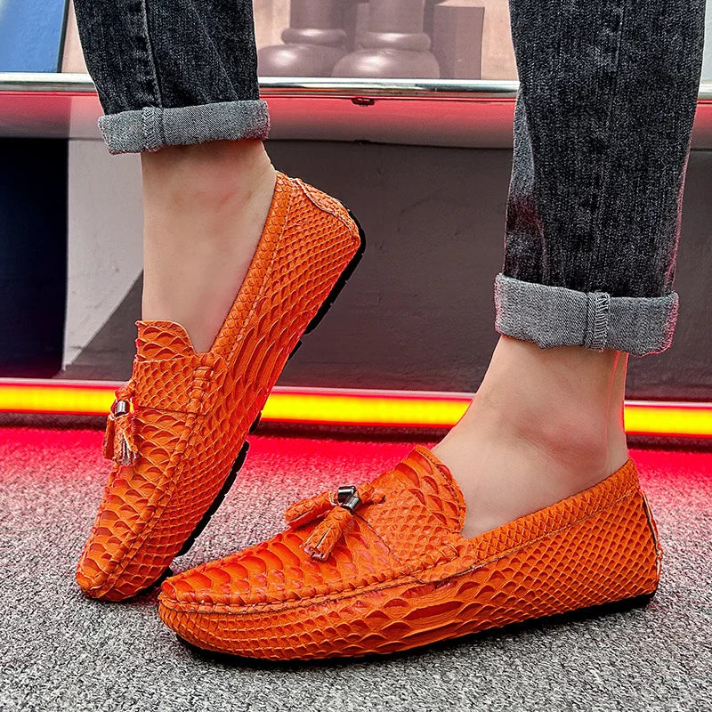 Pair of men's brown loafers with ventilated leather upper and driving shoe sole