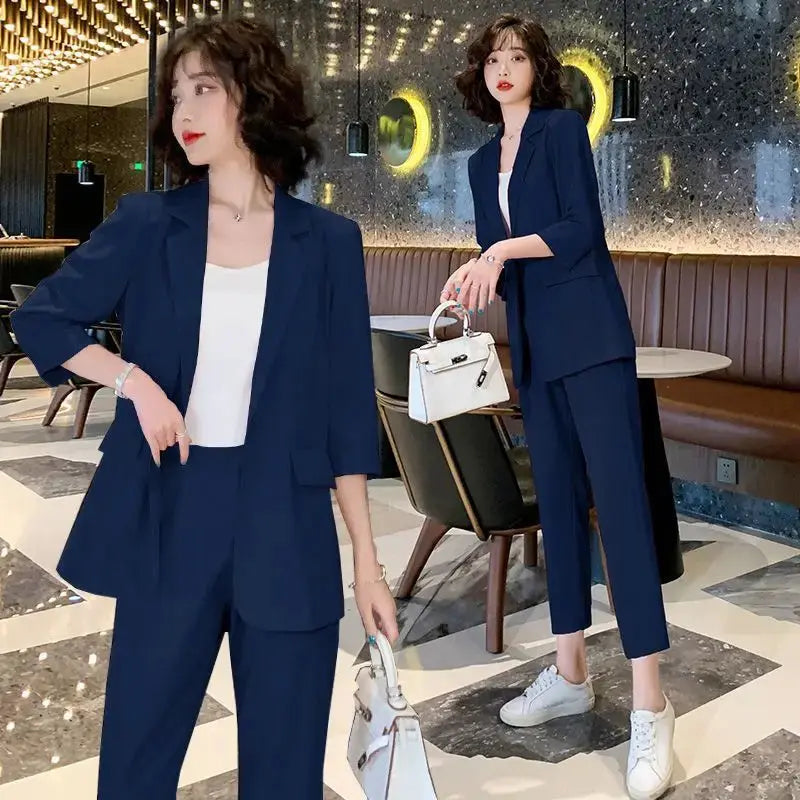 Side view of the green blazer and pants set, showcasing comfort and versatility in design.