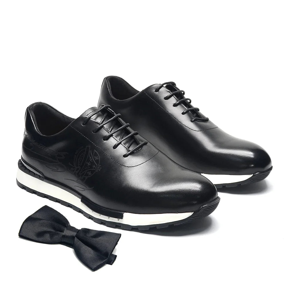 Detail shot of oxford shoe lace-up closure and totem accent on genuine cow leather upper