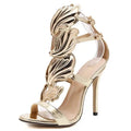 Gold Wings Stiletto sandals perfect for gala events, featuring open toe and eye-catching wing details.