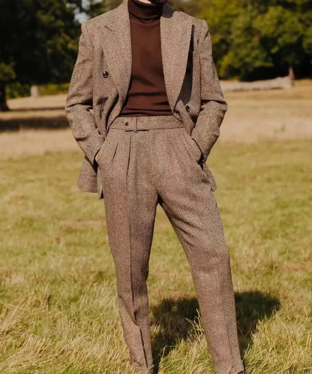 Double-breasted herringbone suit in sharp gray, showcasing tailored elegance.