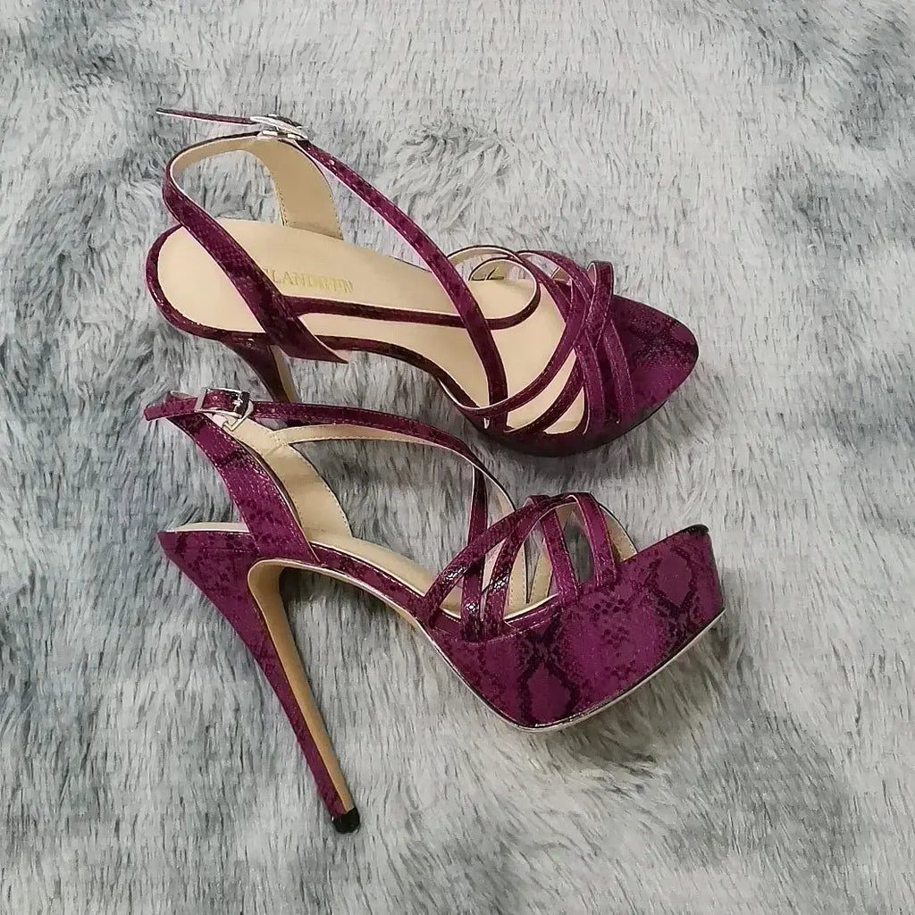 Elegant platform high heels featuring a bold snakeskin pattern.