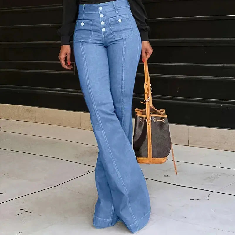 High-waist jeans paired with a sophisticated blouse for a day-to-night look.
