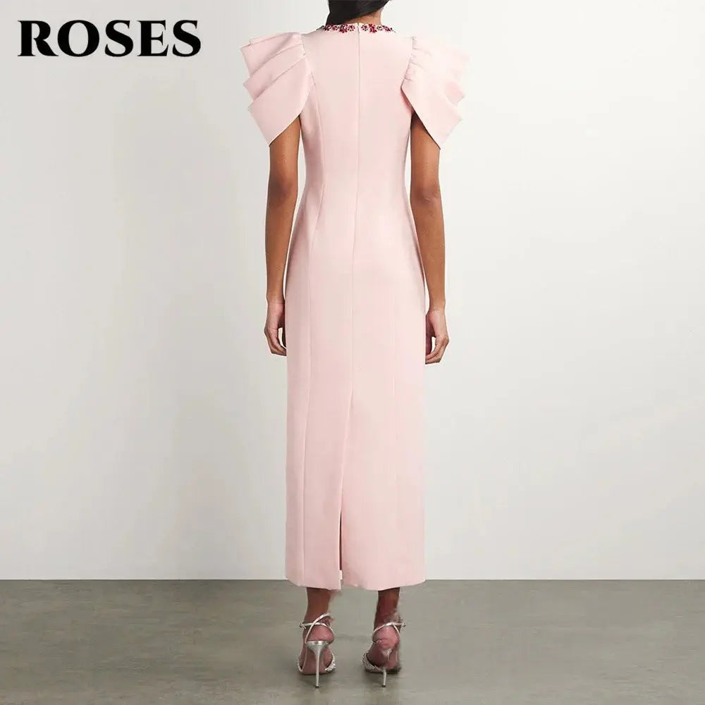 Close-up of puff sleeves on a custom tailored pink evening gown.