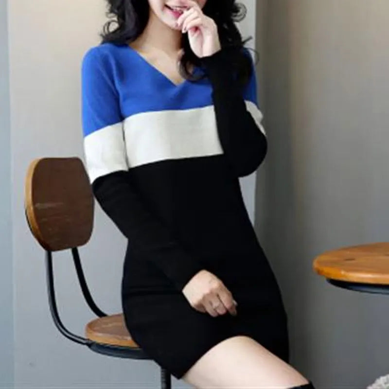 Autumn Whisper mini dress paired with boots for a trendy street style outfit.