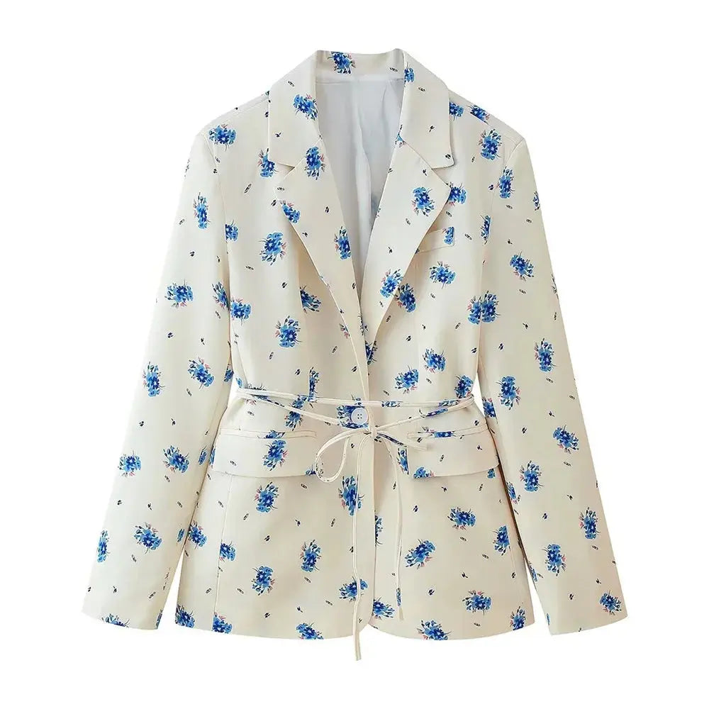 Floral Whisper Belted Jacket in lightweight polyester with a cinched waist and subtle floral pattern.