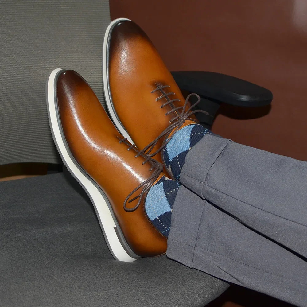 Close-up of handcrafted cowhide Oxford showing smooth whole-cut leather surface and refined silhouette