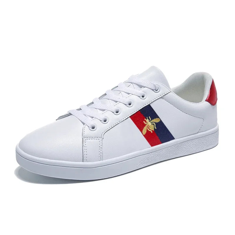 Close-up of bee embroidered flat sneakers with breathable microfiber upper