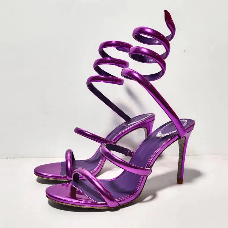 Serpentine Elegance Heels in black leather with snake-shaped ankle wrap.