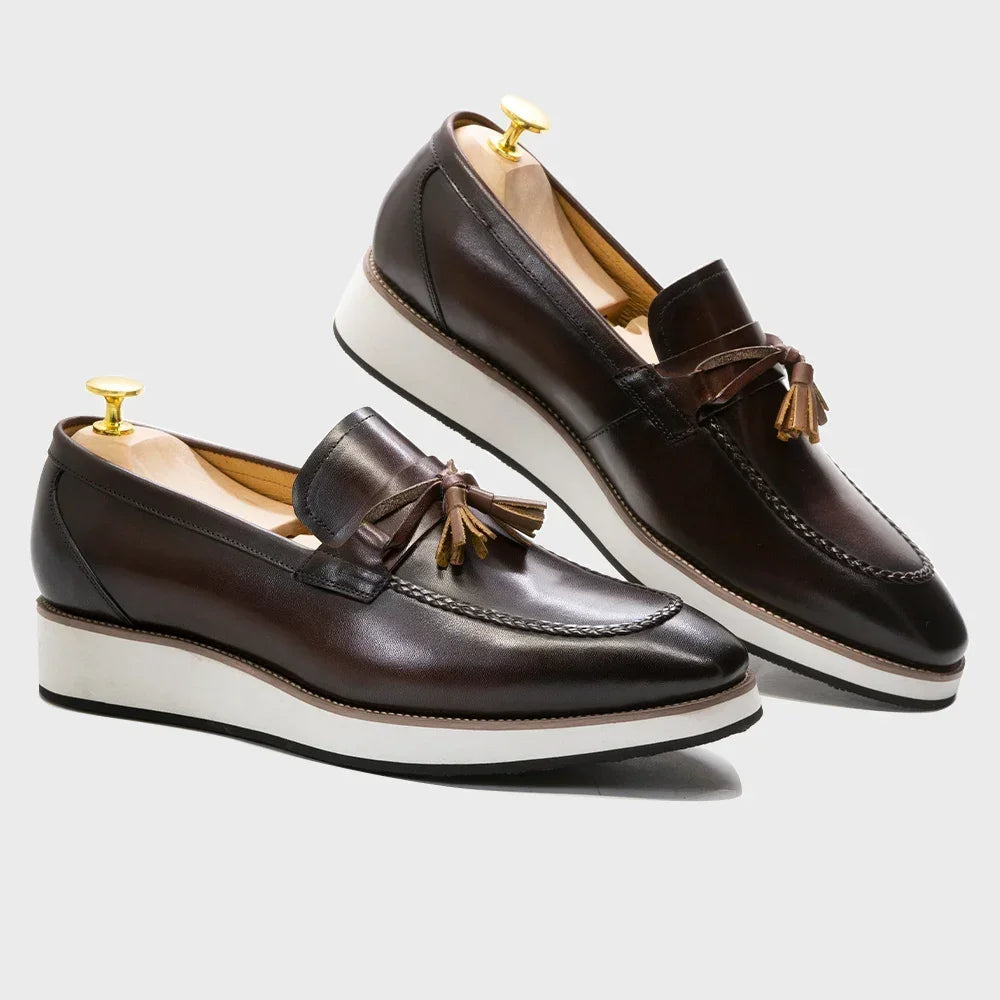 Close-up of genuine calfskin leather tassel loafers showing premium craftsmanship and fringe detail
