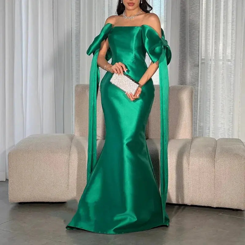 Luxurious strapless evening gown in emerald, crafted for a confident and enchanting look.