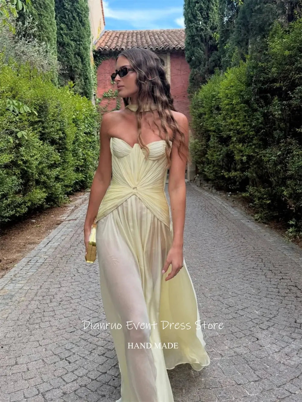 Back view of the yellow chiffon gown highlighting the built-in support.