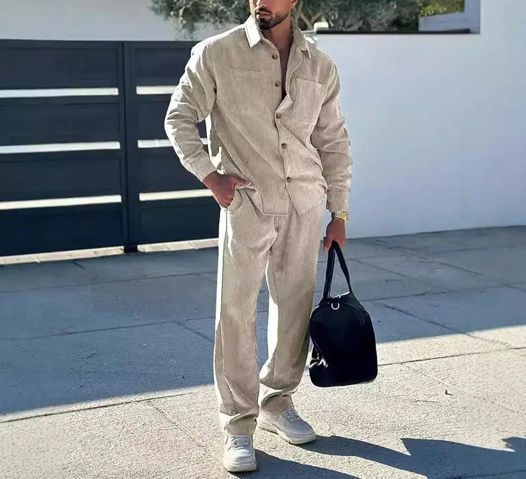Model wearing a stylish navy leisure suit at an outdoor gathering.
