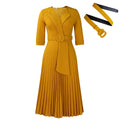Side view of the dress, showcasing the mid-calf length and elegant pleats.