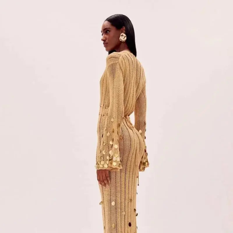 Model wearing the Midnight Shimmer Maxi dress, capturing the light with its shimmering sequins.