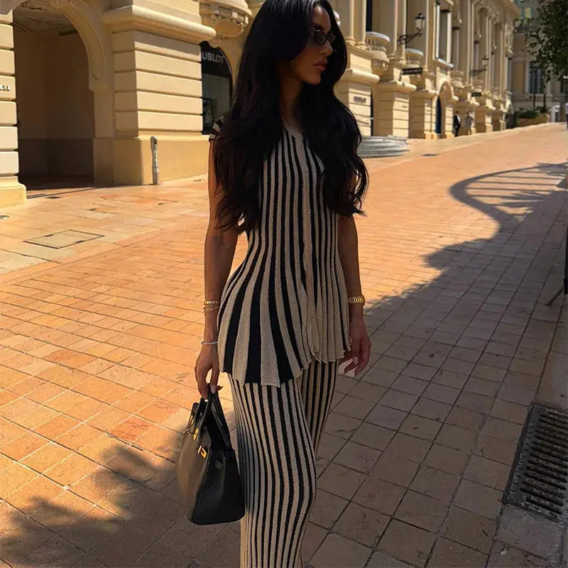 Close-up of the V-neck design on the stylish striped knit top for a confident look.