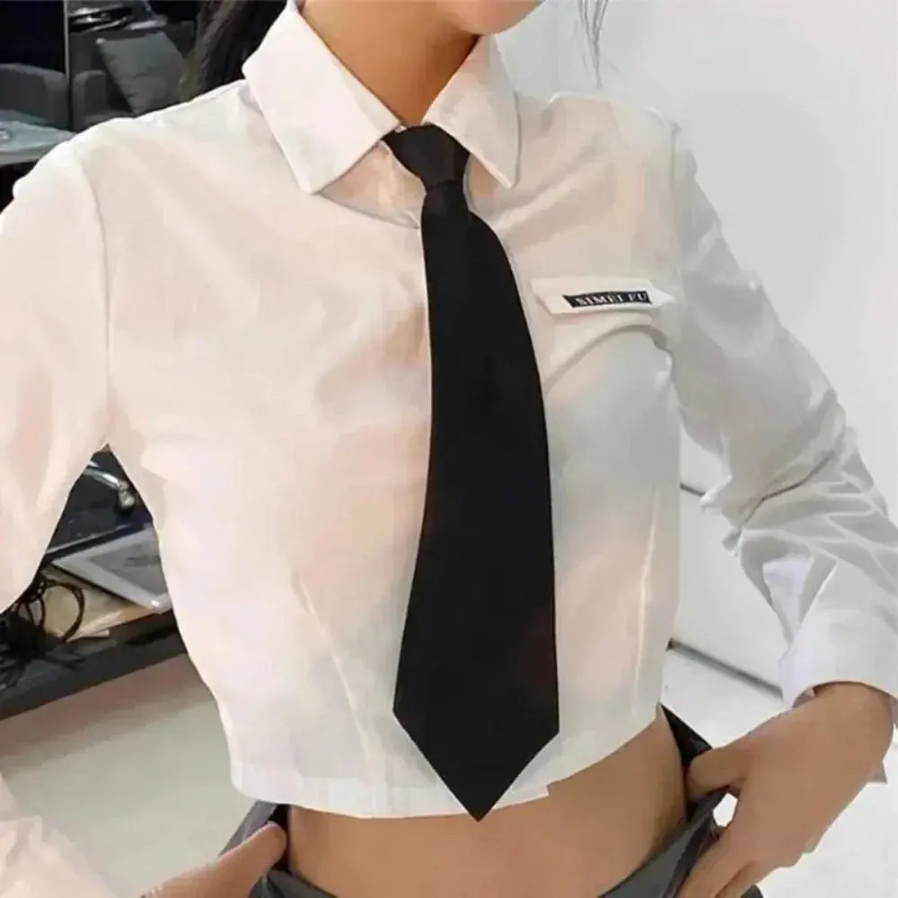 Sophisticated black tie paired with a casual blazer, perfect for versatile fashion choices.