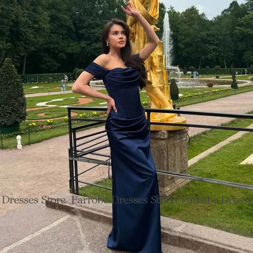 Elegant floor-length gown showcasing pleated detailing and a sophisticated silhouette.