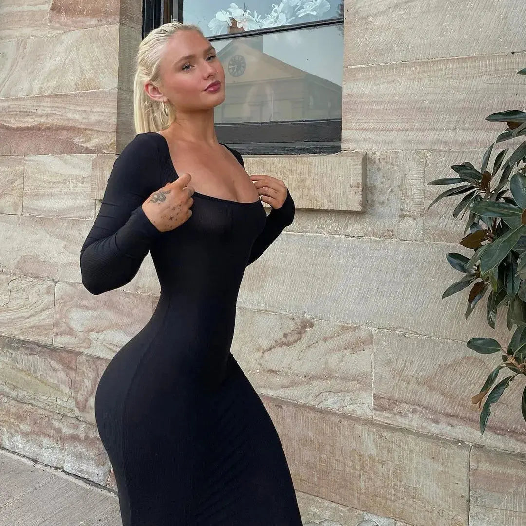 Midnight Whisper fishtail dress in sleek black, showcasing a strapless design and elegant silhouette.