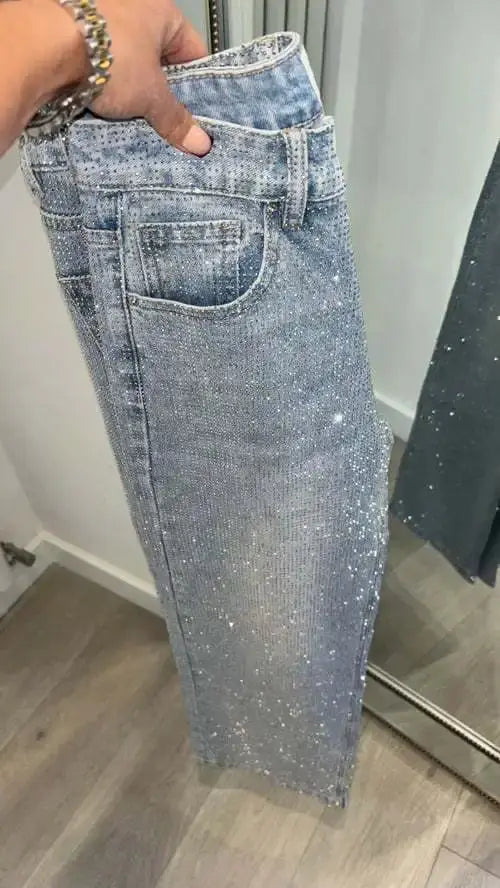 High-waist radiance jeans paired with a chic top for a night out.