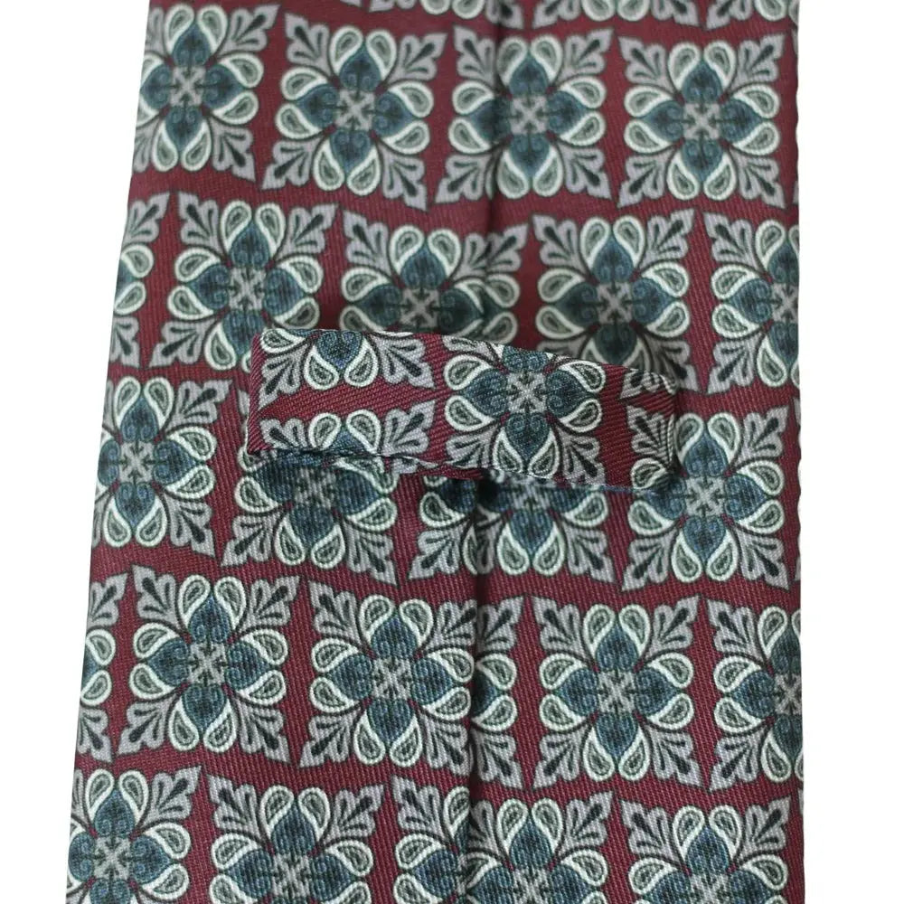 Geometric Allure tie displayed against a neutral background, highlighting its vibrant color.