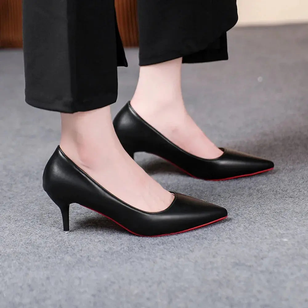 Top-down view of black heels, showcasing the sleek design and pointed toe.
