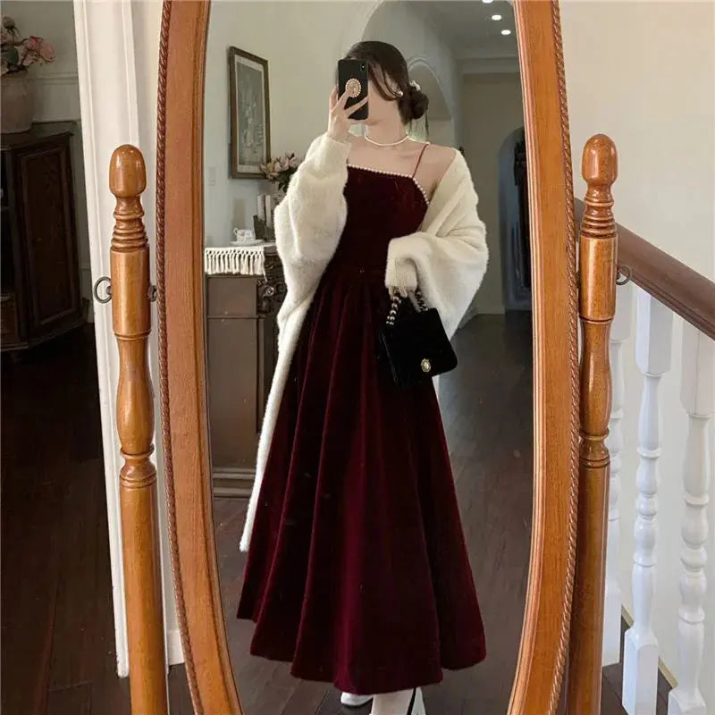 Model wearing the Midnight Whisper Velvet Midi Dress, highlighting its flattering silhouette and graceful draping.