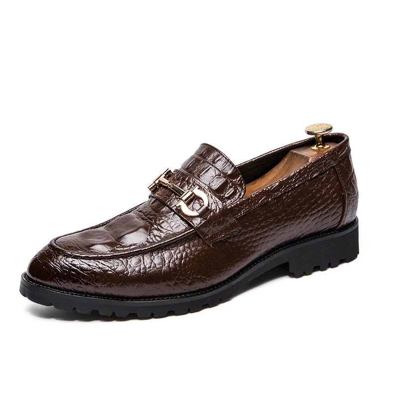 Fashion loafers with metallic decoration, ideal for professional settings.
