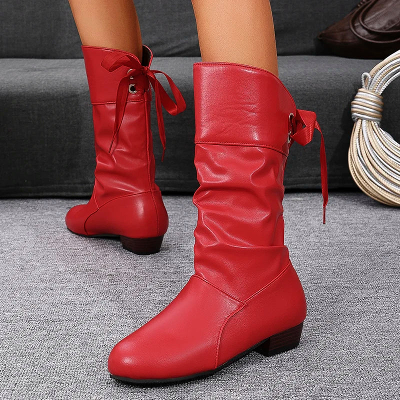 Black lace-up cowboy boots with mid-calf height and textured leather finish