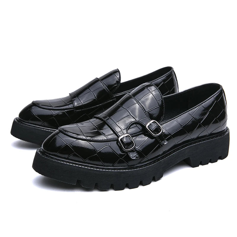 Side view of British-style men's loafers displaying classic cut, leather upper, and durable rubber sole