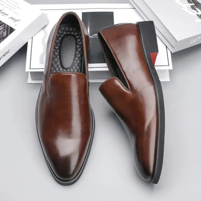 Men's black business loafers featuring iconic red sole detail and slip-on design for professional wear