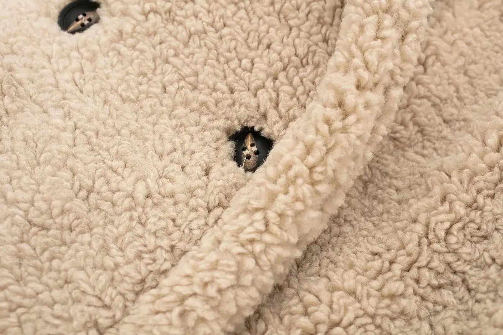 Winter Whisperer coat displayed on a hanger, showcasing its elegant design and modern elegance.