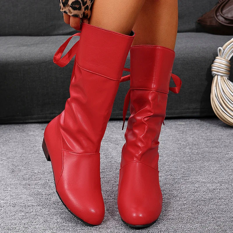 Women's western boots showcasing unique pleated texture and comfortable fit
