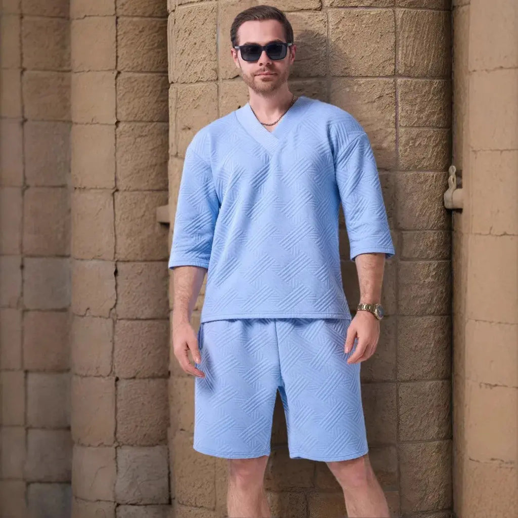 Flat lay of Summer Breeze Set, featuring stylish V-neck and adjustable shorts.