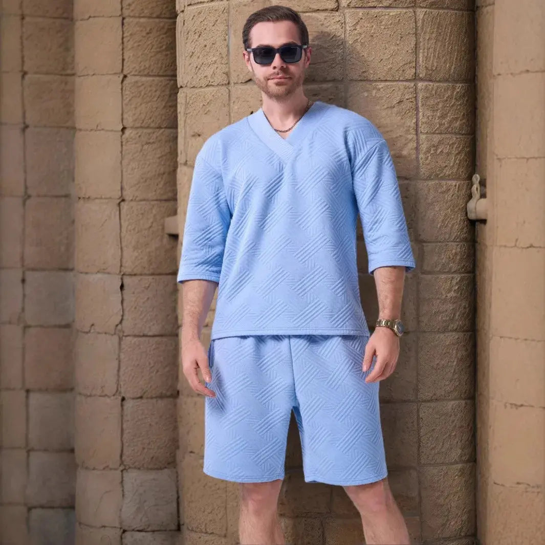 Flat lay of Summer Breeze Set, featuring stylish V-neck and adjustable shorts.