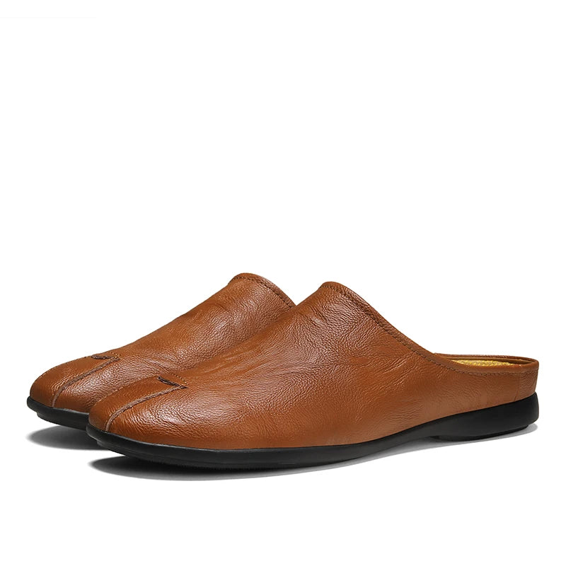 Tan genuine leather slip-on mules with non-slip rubber sole on white background