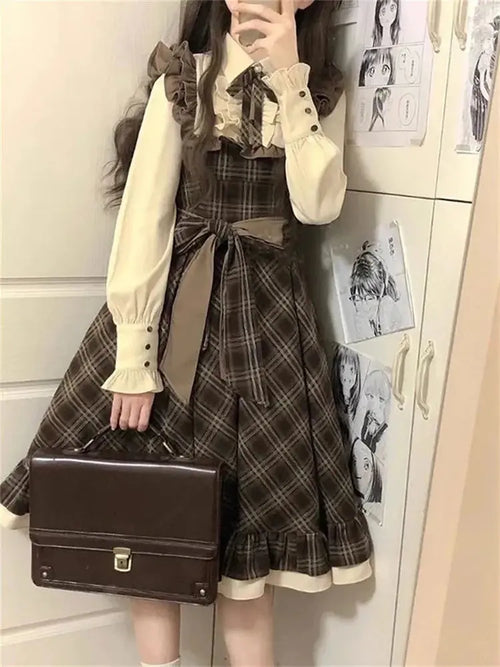 Autumn Whisper ruffle midi dress in plaid with structured polo neckline and bow detail.