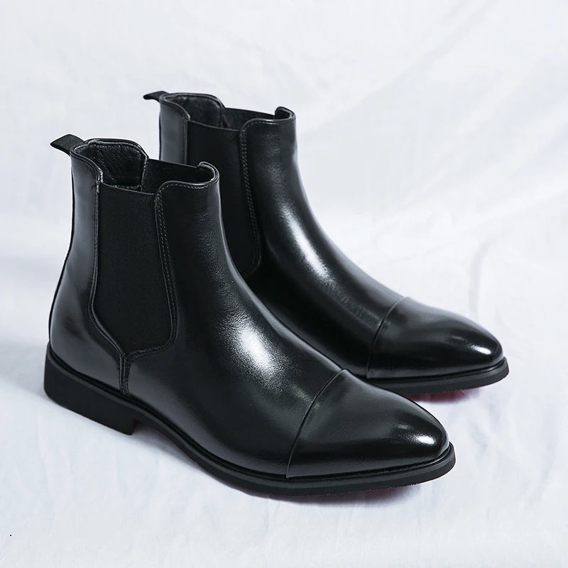 Men's waterproof Chelsea boots featuring signature red outsole and sleek ankle-height silhouette