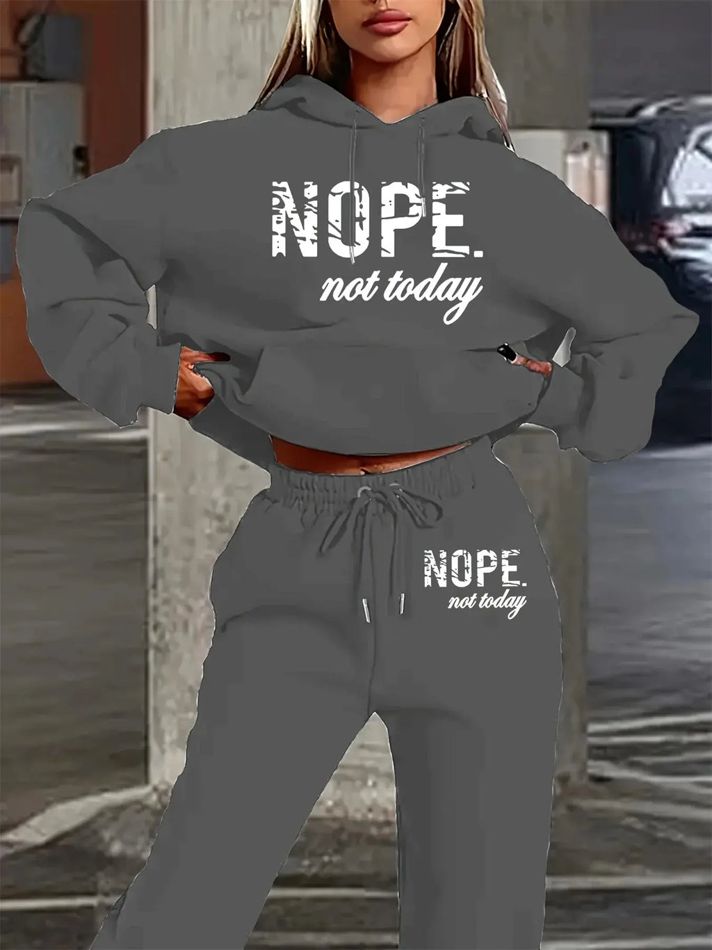 Black hooded loungewear set featuring eye-catching typography perfect for casual autumn and winter wear